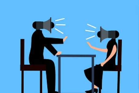 Two coworkers in a workplace disagreement