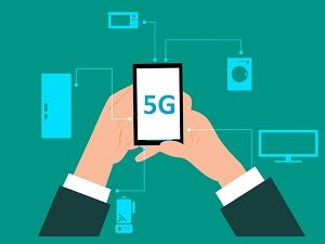 Illustration of hands holding a 5G smartphone connected to devices