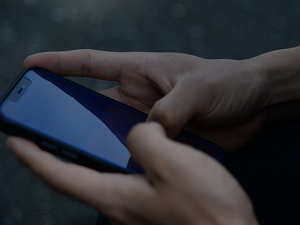 Hands holding an iPhone