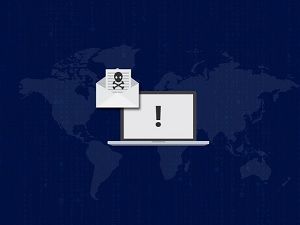 Ransomware alert on a laptop with a malicious email, illustrating WannaCry